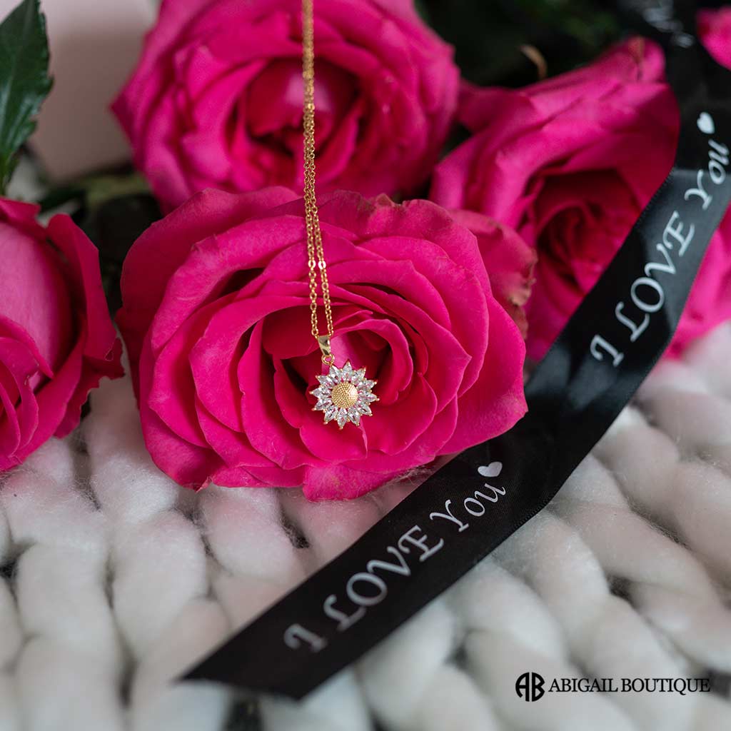 Preserved Roses In A Lux Floating Heart Shaped Box With A Sunflower Necklace