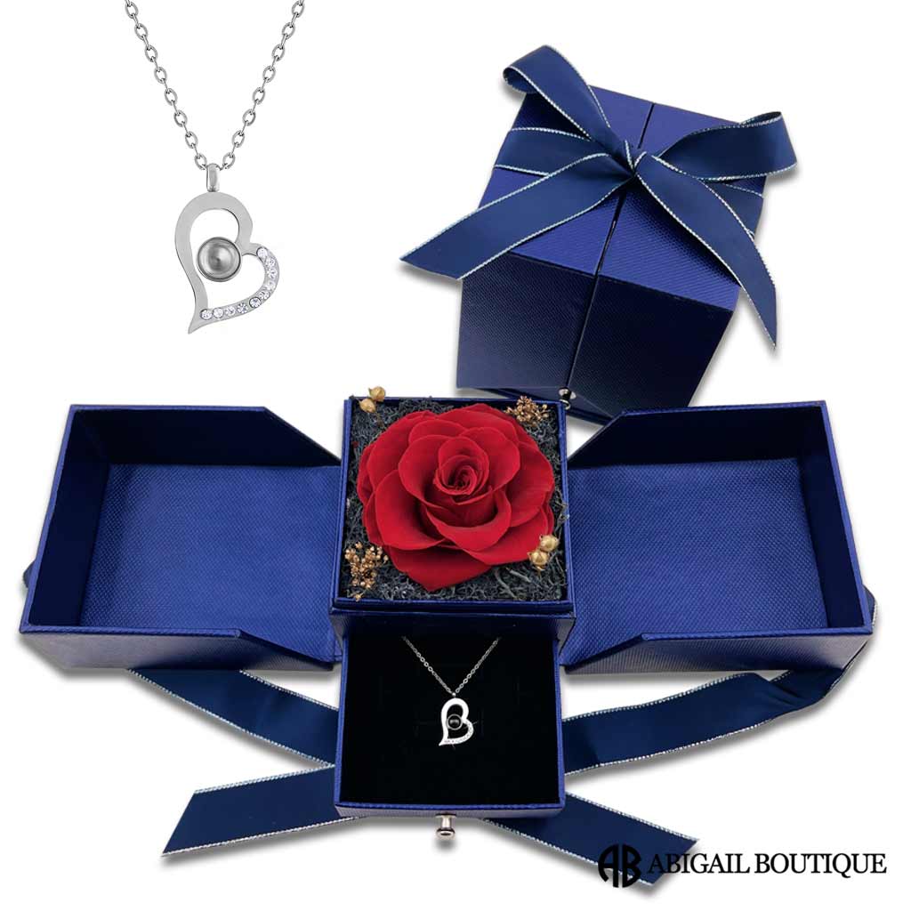 https://abigailboutique.com/cdn/shop/products/Royal-Blue-Preserved-Rose-With-Silver-Heart-Projection-Necklace_1200x.jpg?v=1664321414